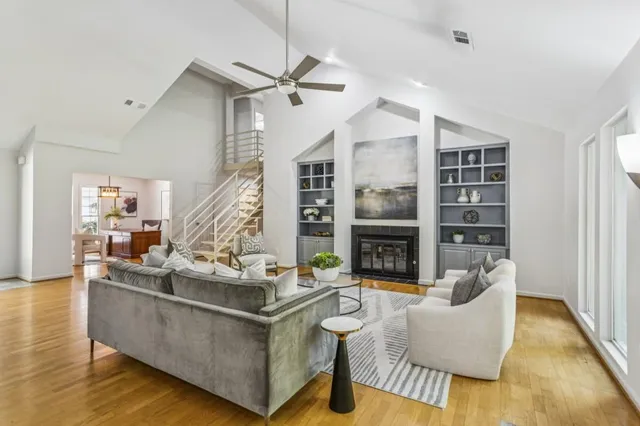 a living room with fireplace furniture and a fireplace