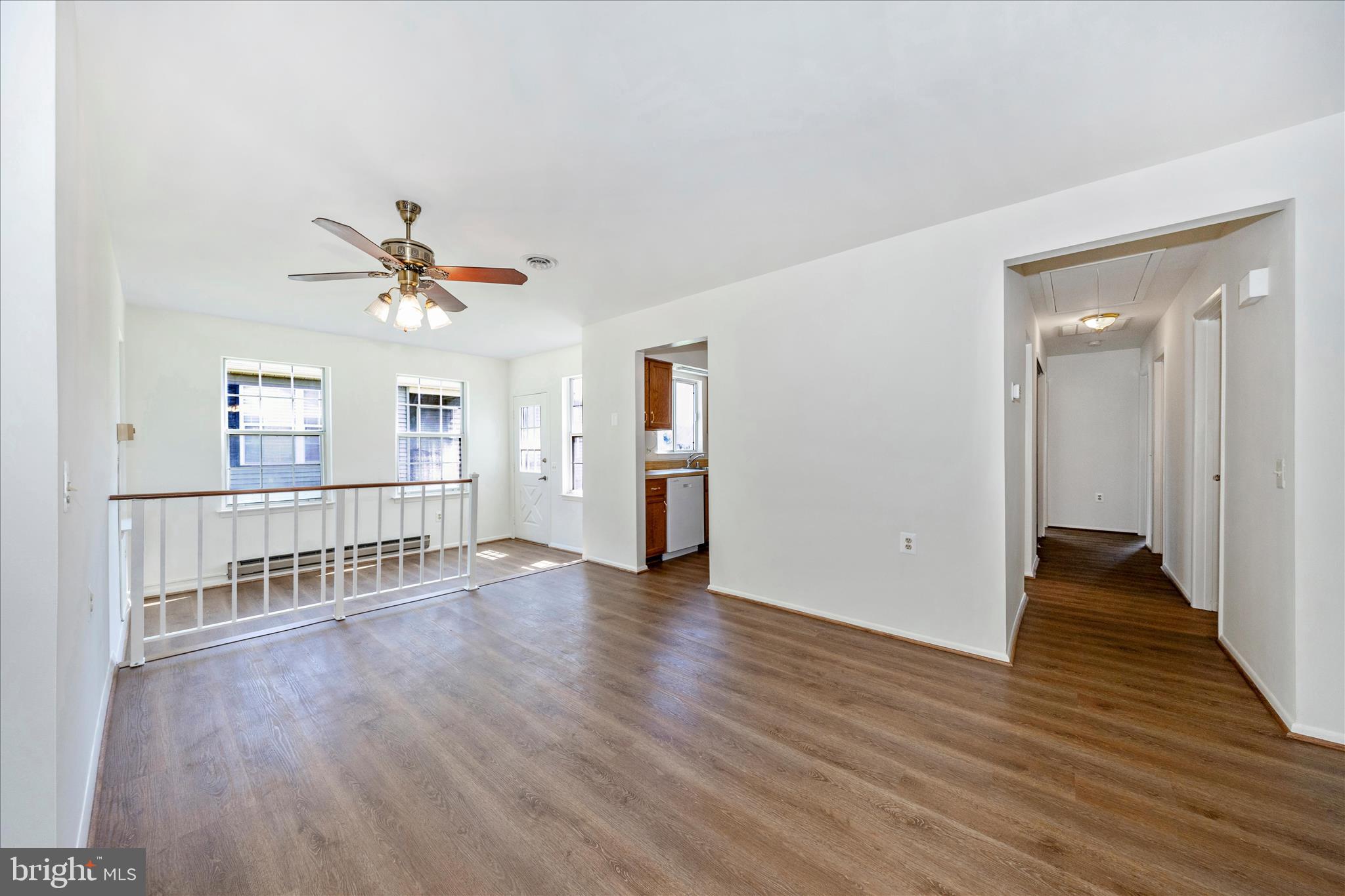 5738 Box Elder Court Frederick, MD 21703 - Photo 7 of 50 a view of an empty room with wooden floor and a window