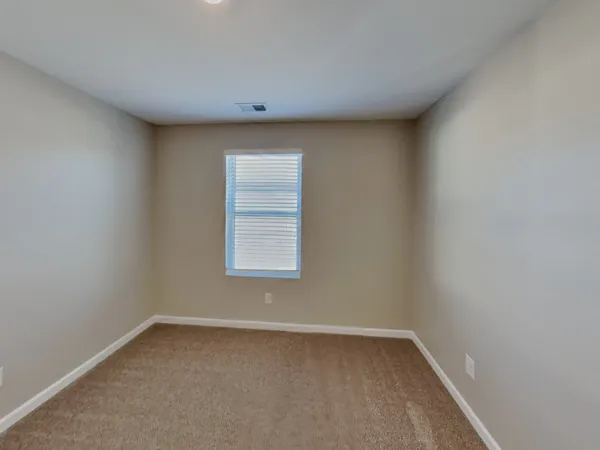 a view of a room that has a window in it