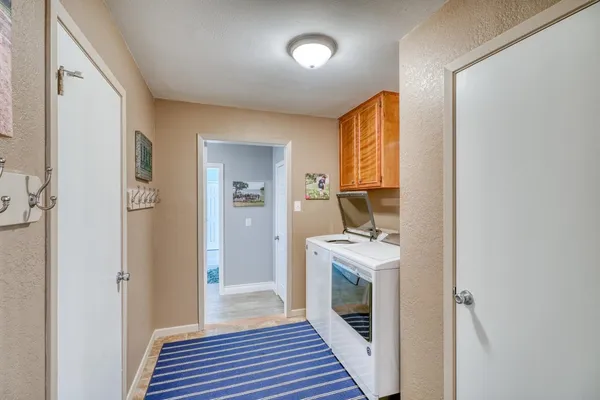 a very nice looking hallway with a large window and a glass door