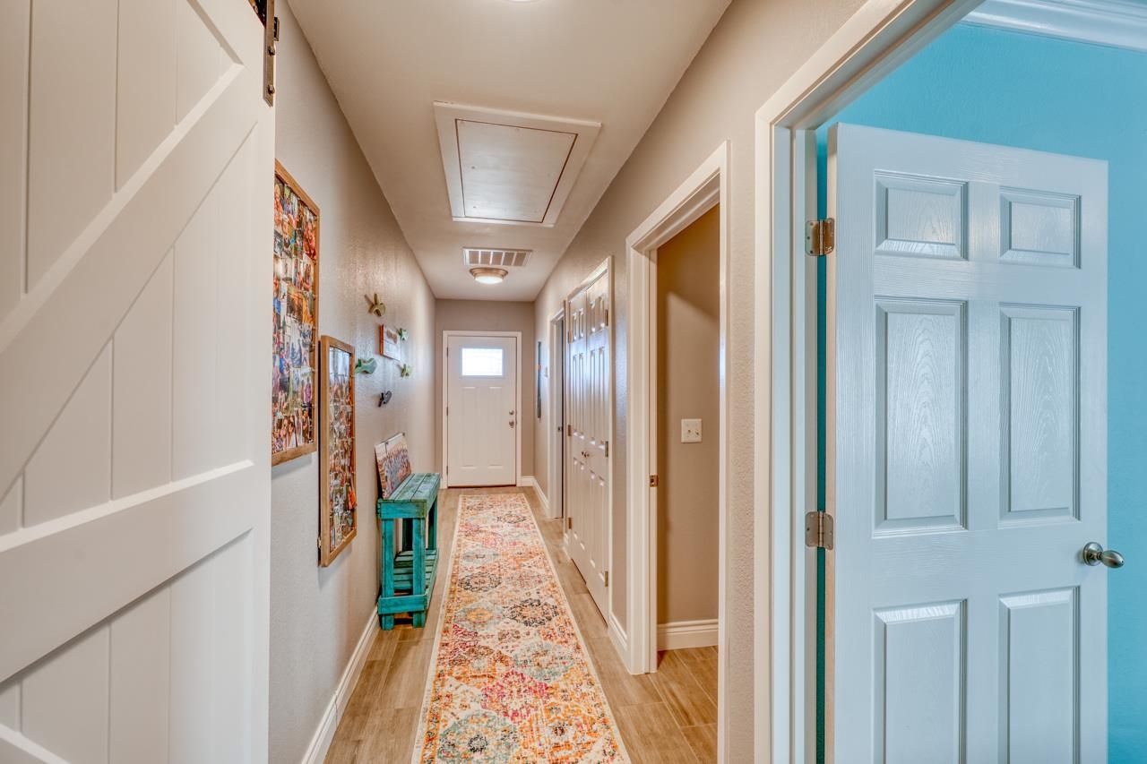 724 South Chaparral Burnet, TX 78611 - Photo 16 of 29 a very nice looking hallway with a large window and a glass door