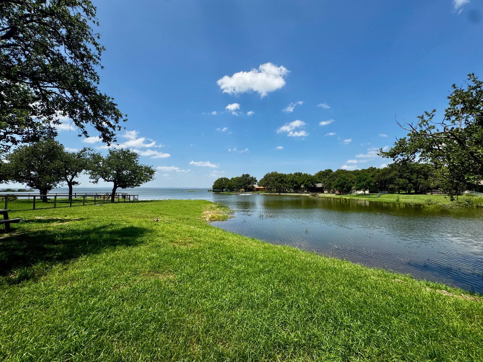 724 South Chaparral Burnet, TX 78611 - Photo 25 of 29 a view of a lake with houses in the back