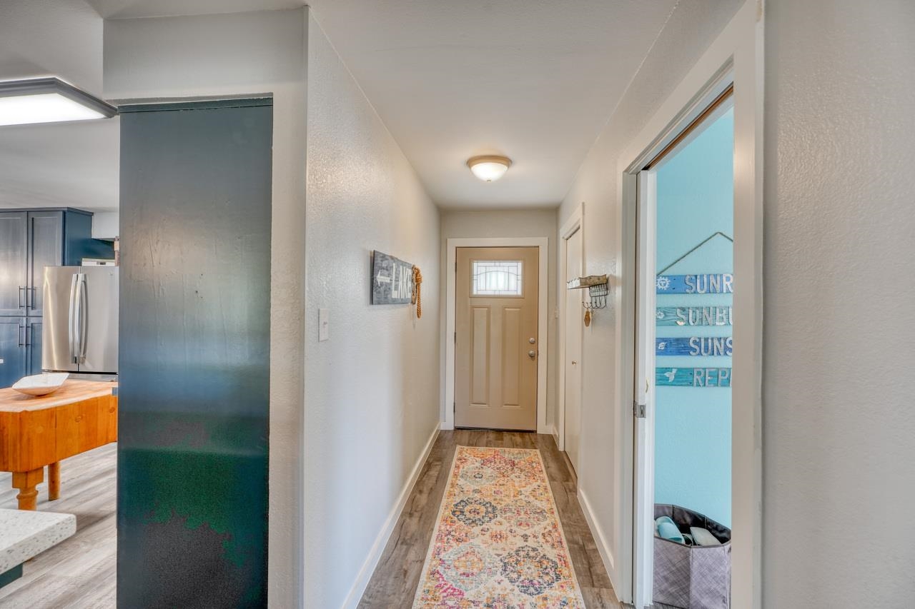 724 South Chaparral Burnet, TX 78611 - Photo 3 of 29 a view of a hallway with bathroom and a mirror