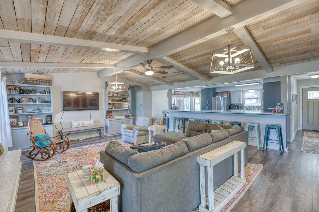 724 South Chaparral Burnet, TX 78611 - Photo 4 of 29 a living room with furniture and a flat screen tv