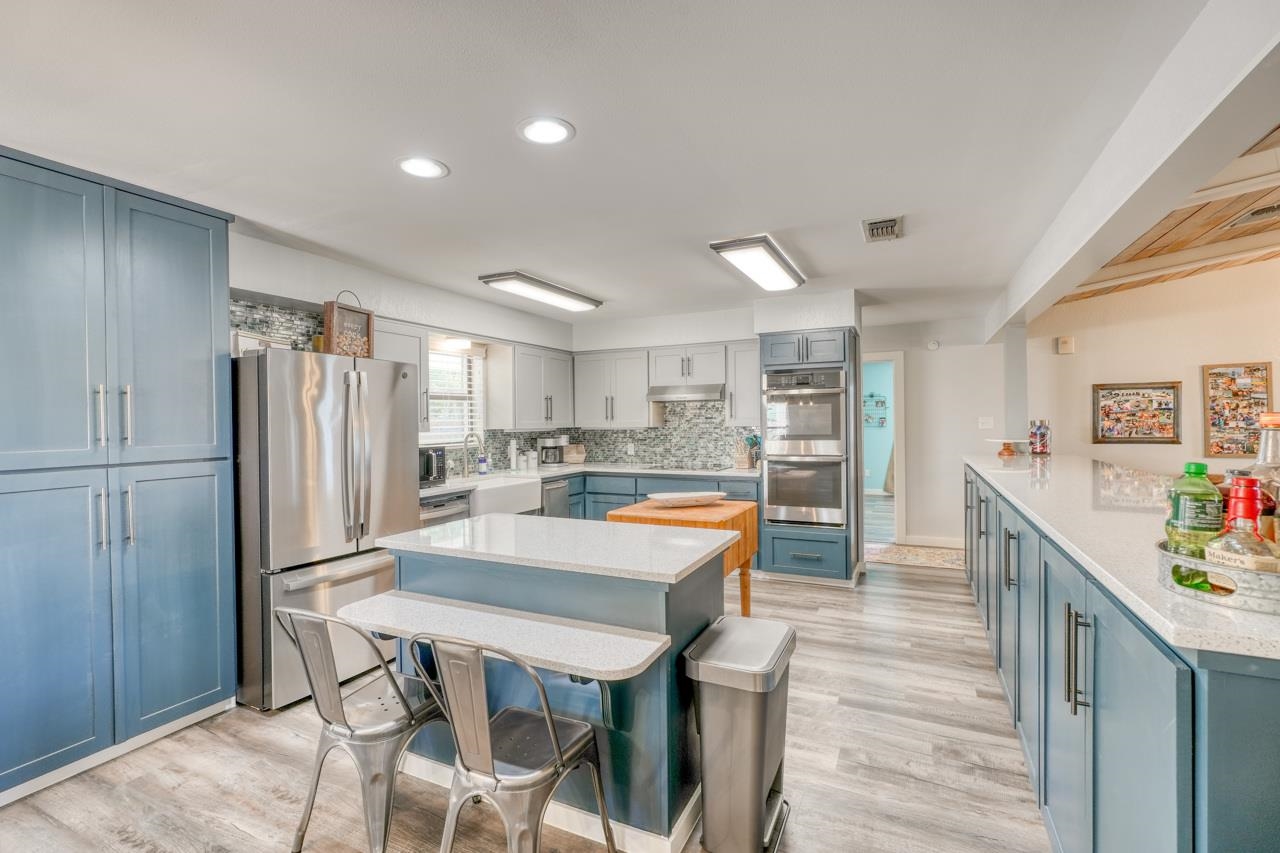 724 South Chaparral Burnet, TX 78611 - Photo 6 of 29 a large kitchen with lots of counter space and refrigerator