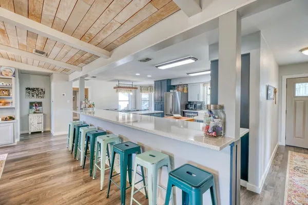 a dining room with furniture window and wooden floor