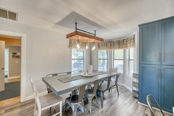 a view of a dining room with furniture window and outside view