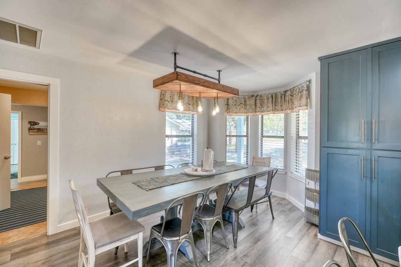724 South Chaparral Burnet, TX 78611 - Photo 9 of 29 a dining room with furniture window and wooden floor