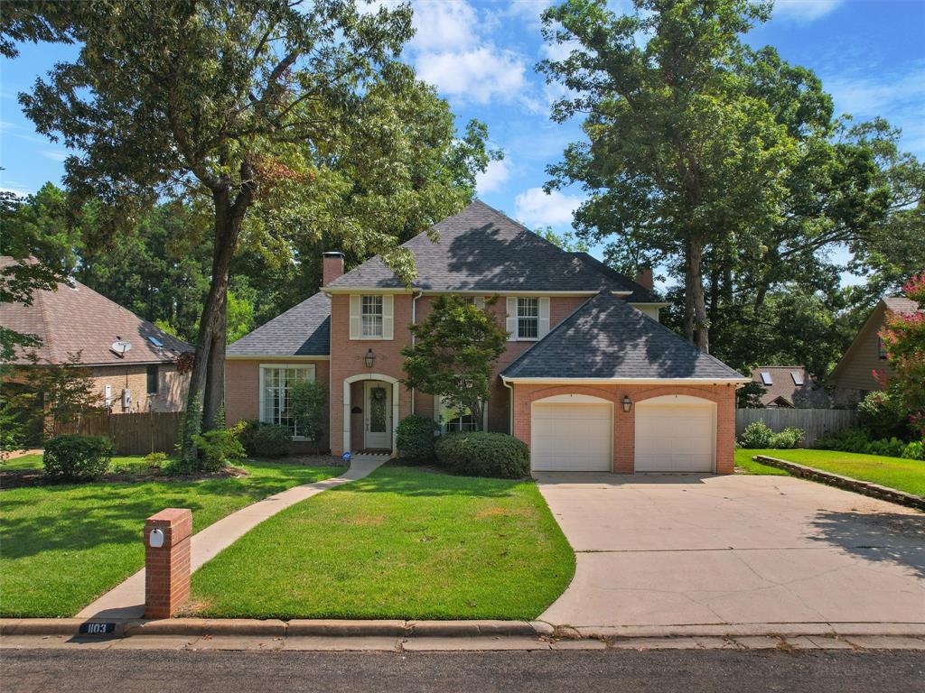 1103 Marigold Lane Longview, TX 75604 - Photo 33 of 34 a front view of a house with a garden