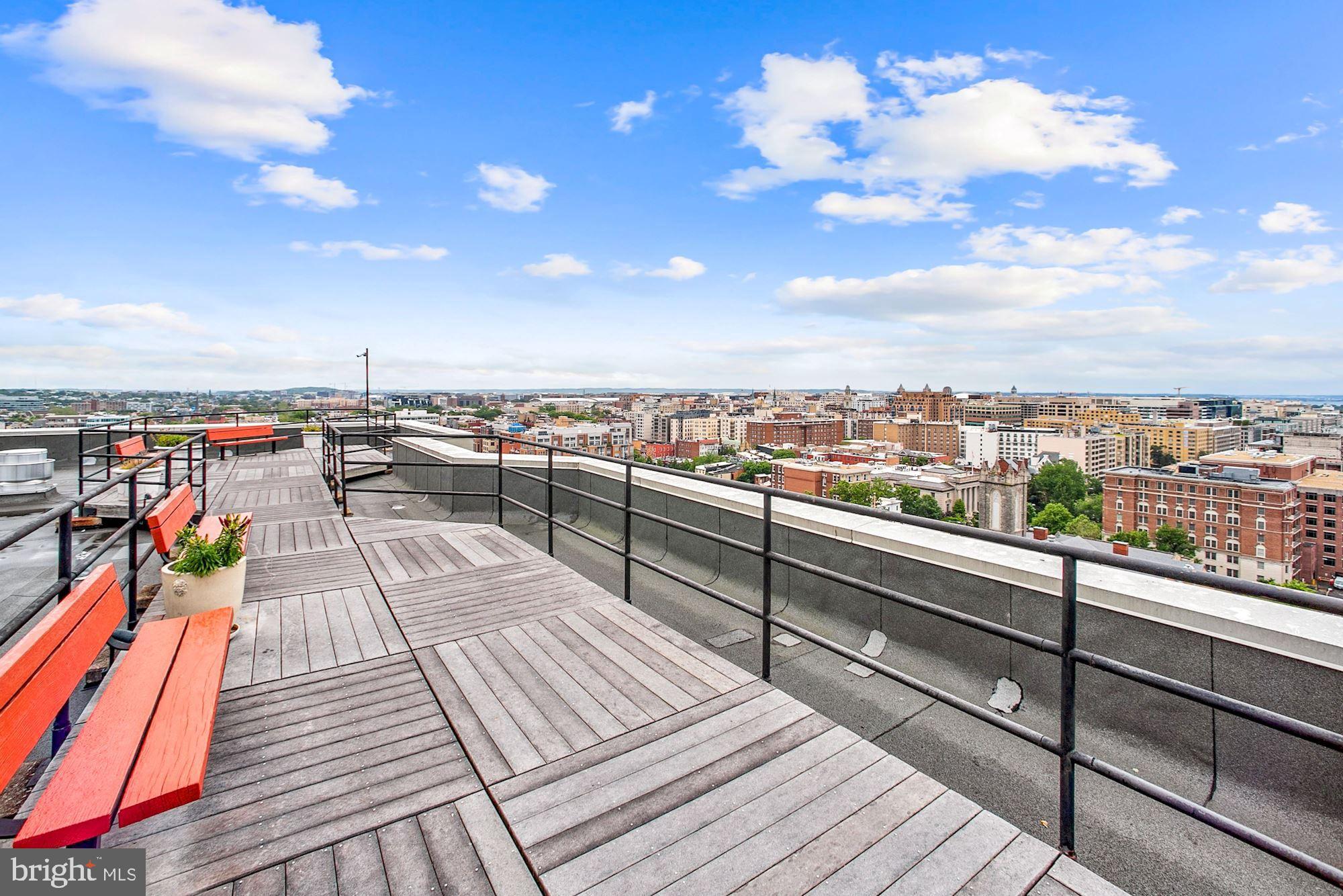 1615 Q Street Northwest, Unit 1012 Washington, DC 20009 - Photo 33 of 39 a view of roof deck with seating space and barbeque oven