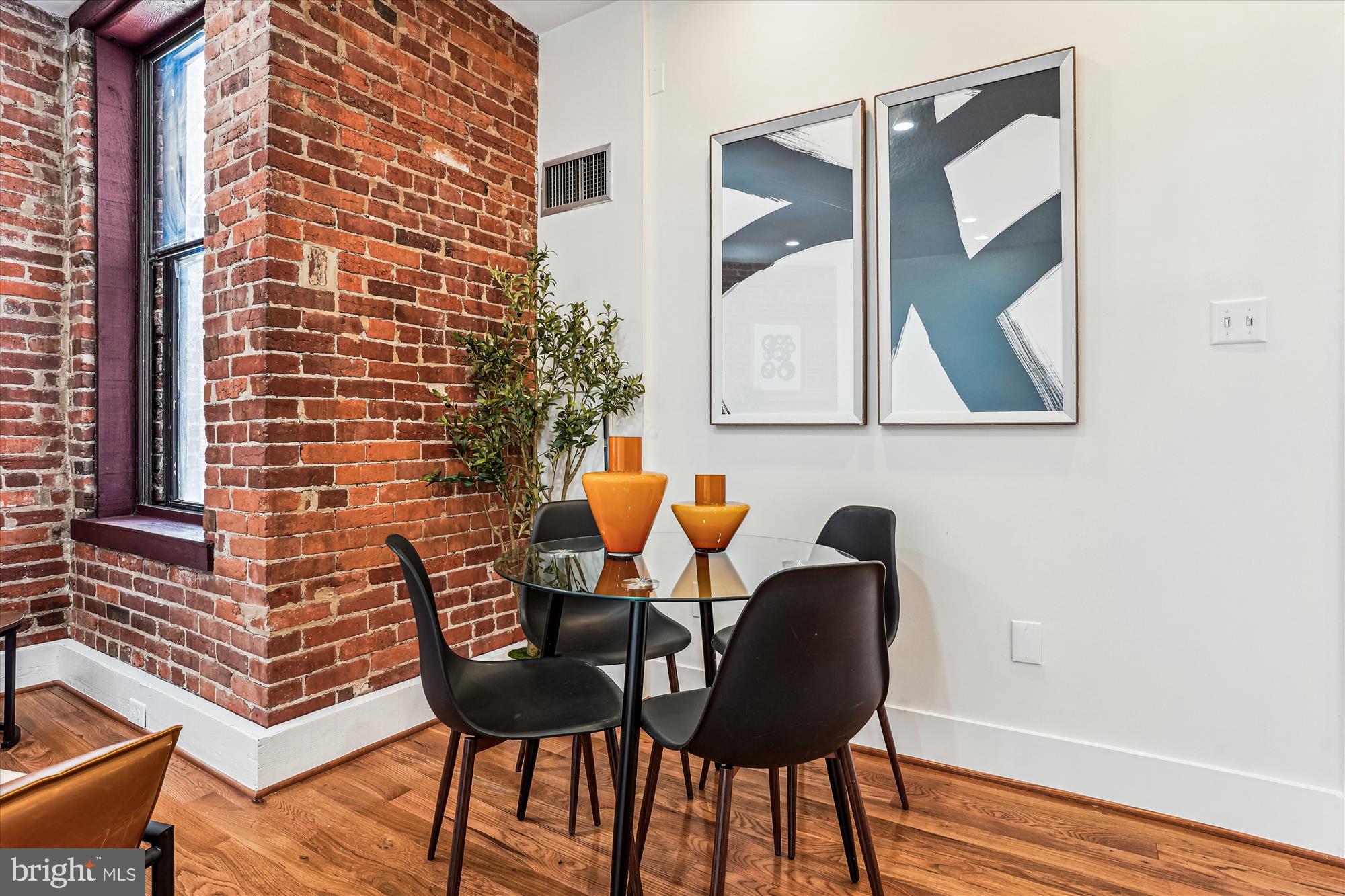 1615 Q Street Northwest, Unit 1012 Washington, DC 20009 - Photo 8 of 39 a view of a room with table and chairs