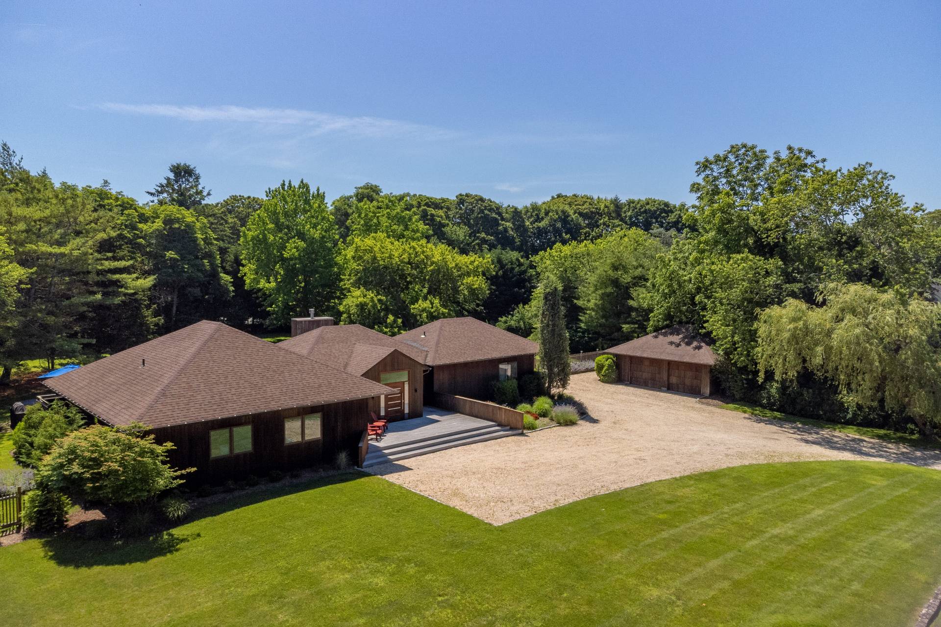 6 Bridle Path Remsenburg, NY 11960 - Photo 2 of 15 a view of a house with a yard and sitting area