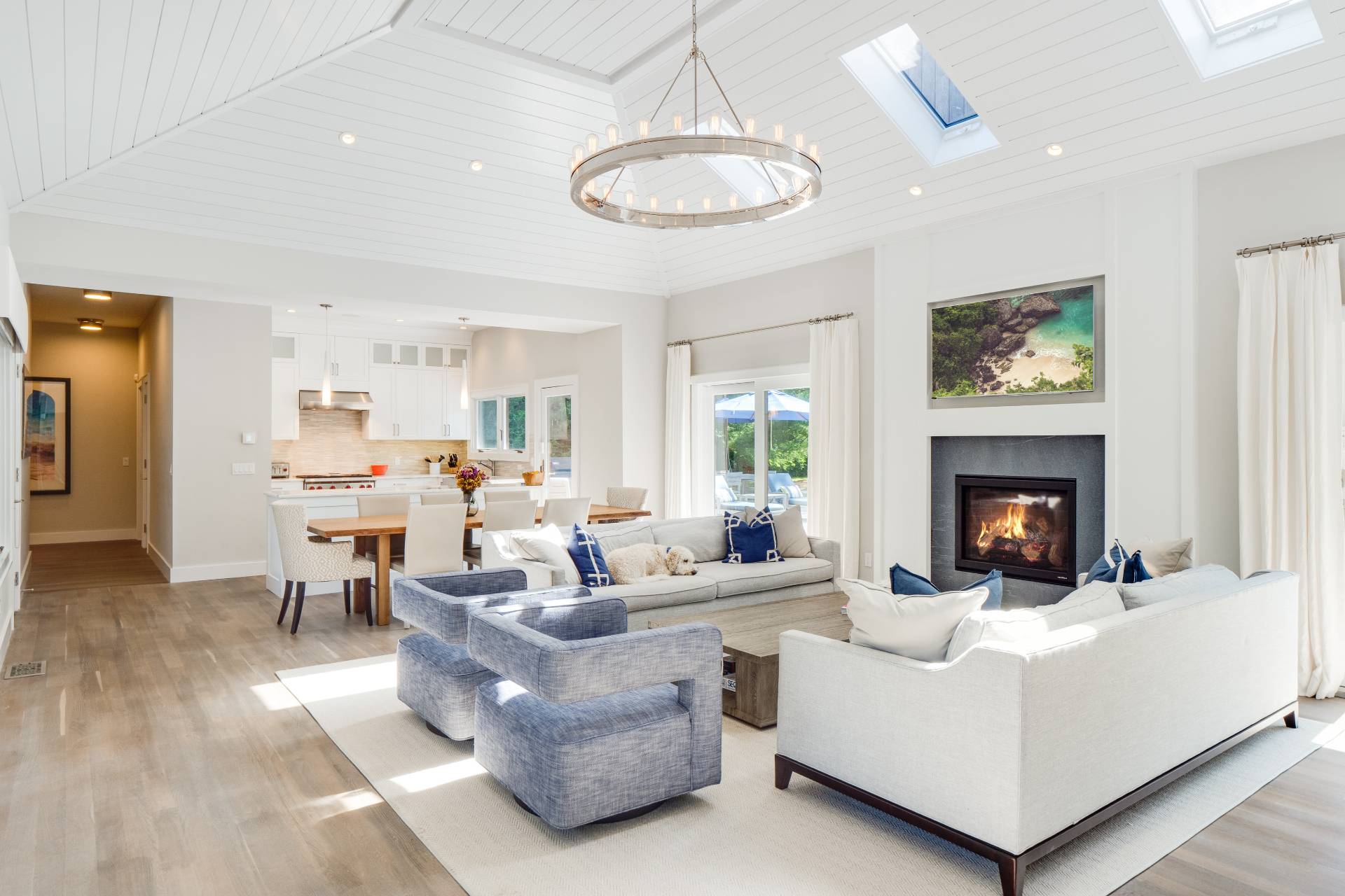 6 Bridle Path Remsenburg, NY 11960 - Photo 3 of 15 a living room with furniture a fireplace and a chandelier
