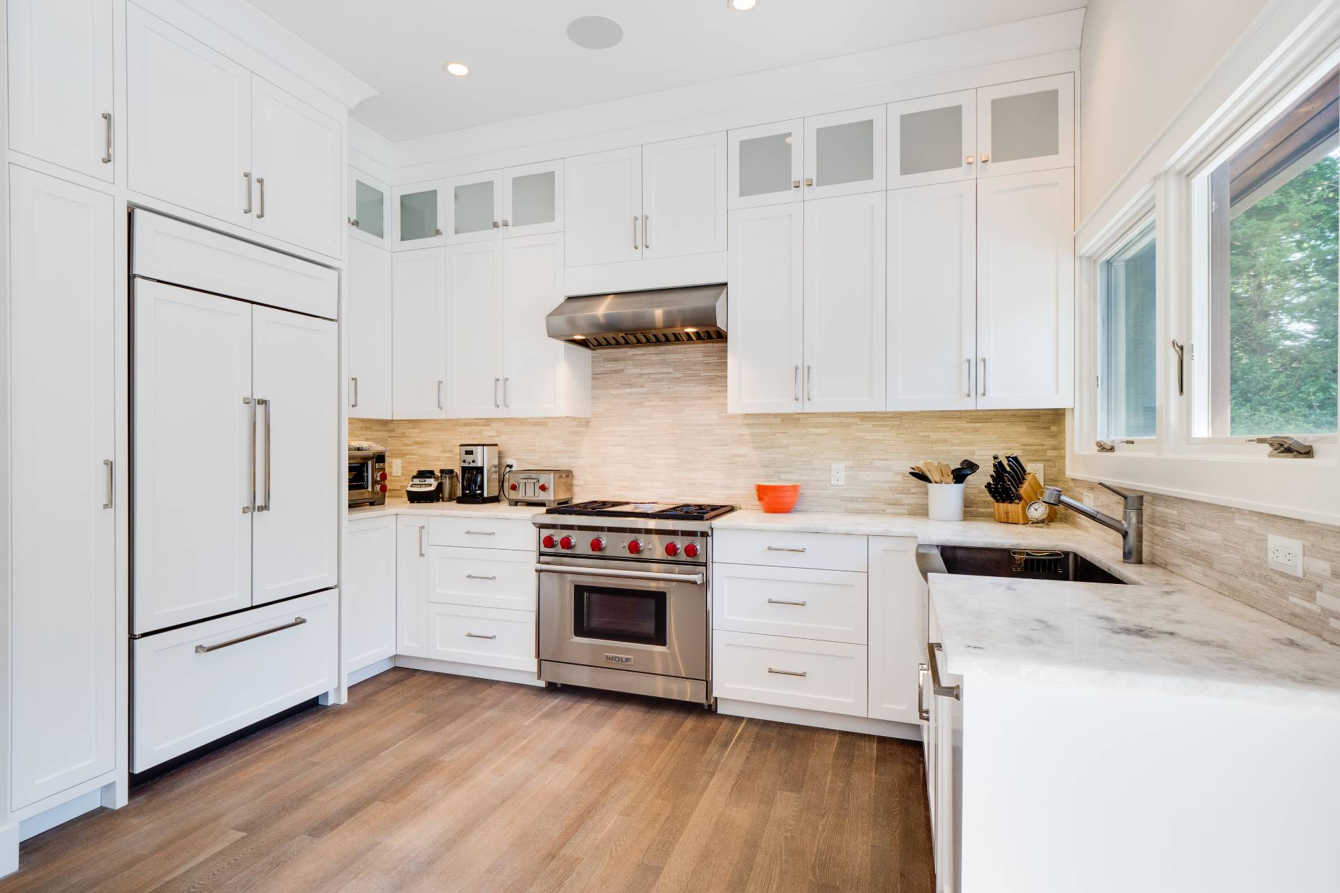 6 Bridle Path Remsenburg, NY 11960 - Photo 5 of 15 a kitchen with white cabinets and white appliances