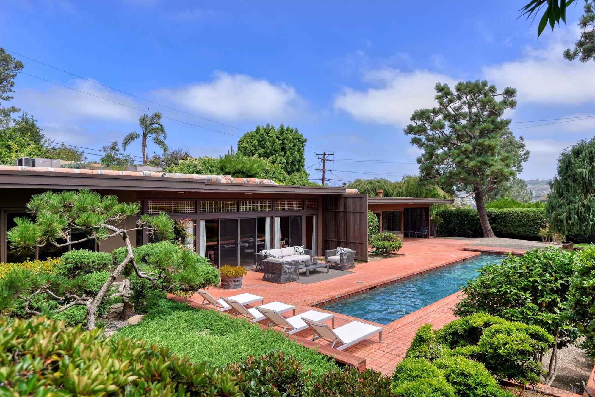 7785 Roseland Drive La Jolla, CA 92037 - Photo 1 of 1 a view of a house with furniture and porch