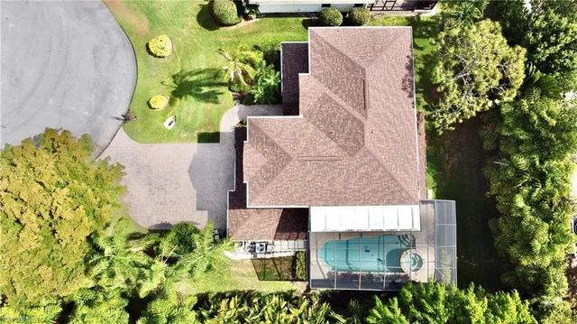 an aerial view of a house with a garden