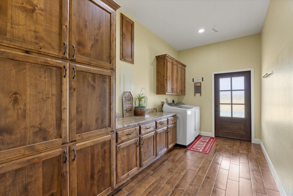 9739 Waldrup Road Lipan, TX 76462 - Photo 22 of 38 Large laundry room with more storage.