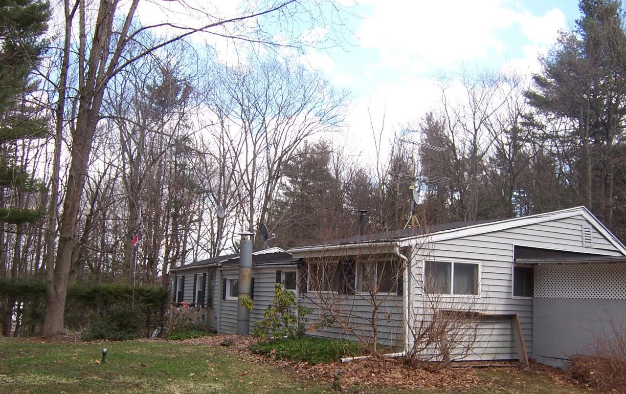 500 Pine Road Otis, MA 01029 - Photo 3 of 10 front view of a house with a yard