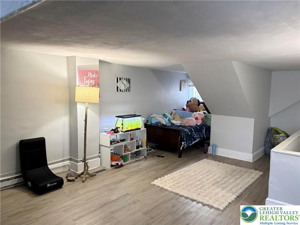 633 Maple Street Bethlehem, PA 18018 - Photo 11 of 14 a living room with furniture and a wooden floor