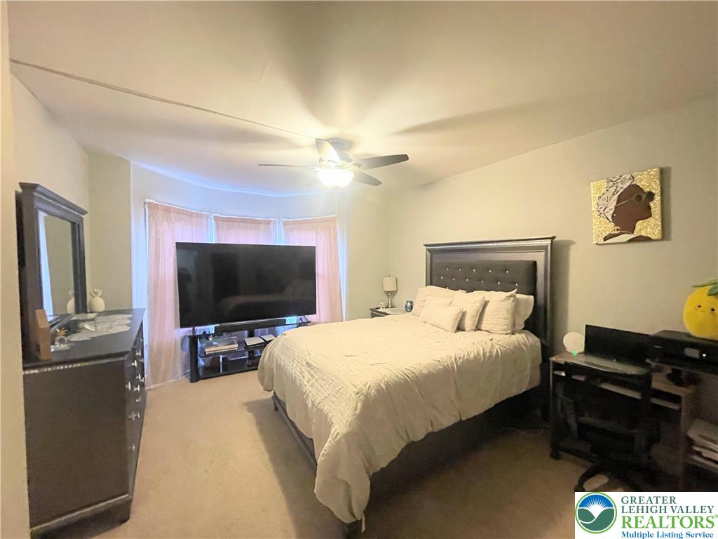 633 Maple Street Bethlehem, PA 18018 - Photo 13 of 14 a bedroom with a bed and a flat screen tv