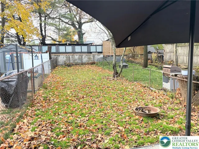 a view of swimming pool with a patio