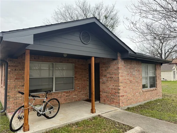 a house with trees in the background