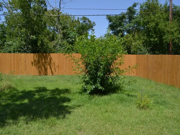 a backyard of a house with lots of green space