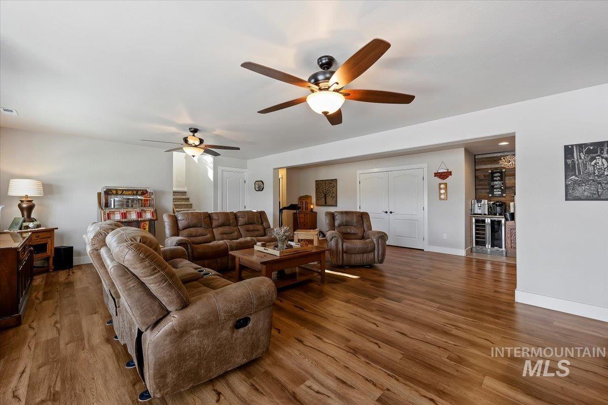 40 Bell Rapids Road Hagerman, ID 83332 - Photo 15 of 50 Living room with a ceiling fan, wood finished floors, and wine cooler