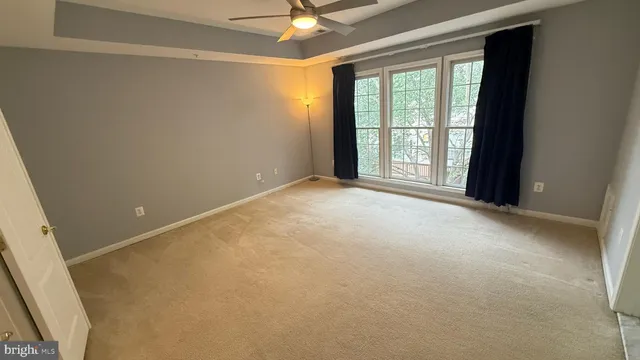 an empty room with a empty space and a window