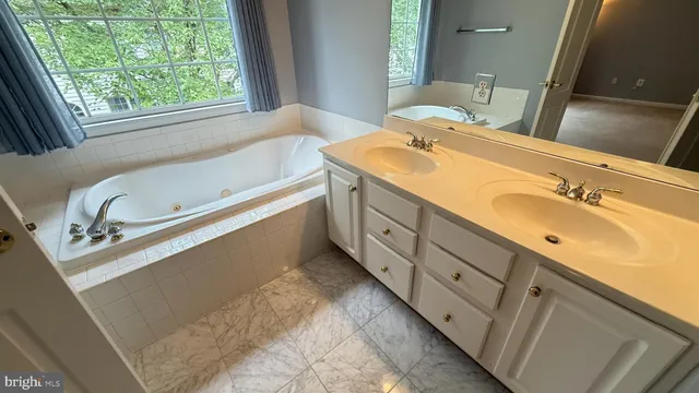 a bathroom with a shower and a glass door