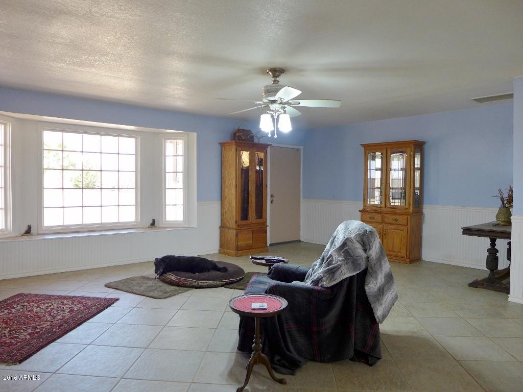 19007 West Roadrunner Road Wittmann, AZ 85361 - Photo 4 of 56 Enormous living room, dual pane