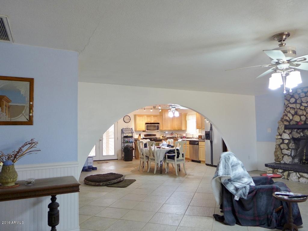 19007 West Roadrunner Road Wittmann, AZ 85361 - Photo 6 of 56 Living Room to Kitchen