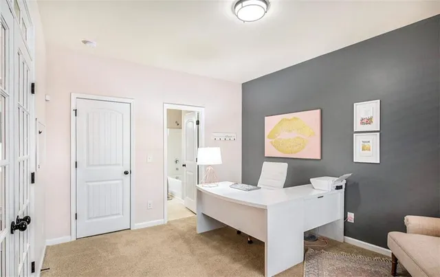 a living room with a bed and furniture