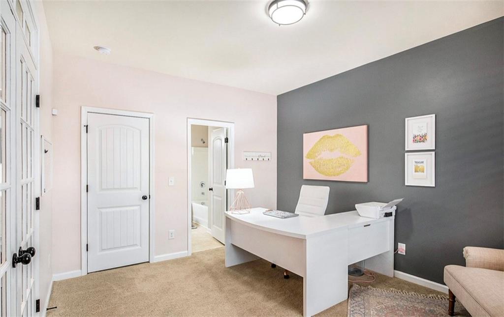 3217 Bowlin Drive Fairburn, GA 30213 - Photo 12 of 28 a living room with a bed and furniture