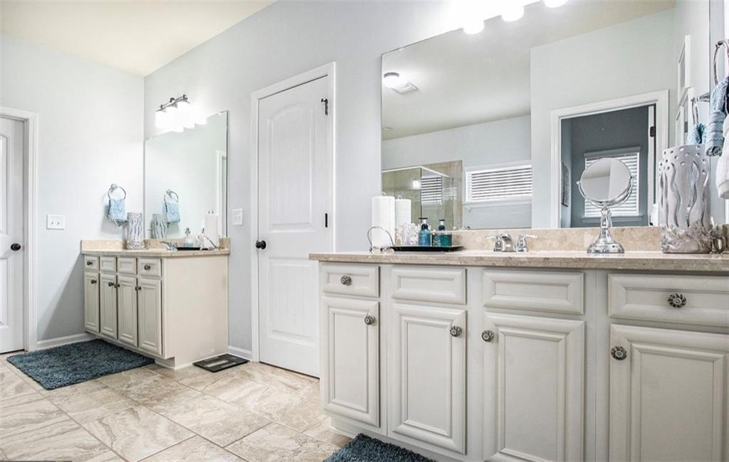 3217 Bowlin Drive Fairburn, GA 30213 - Photo 15 of 28 a bathroom with a double vanity sink and mirror