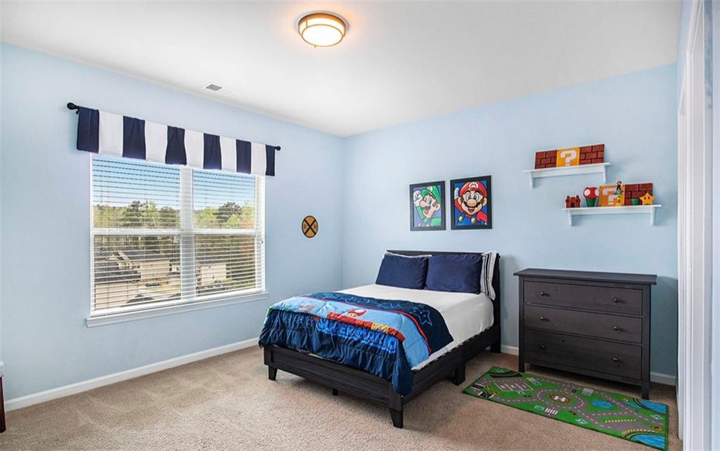 3217 Bowlin Drive Fairburn, GA 30213 - Photo 20 of 28 a bedroom with a bed and a window