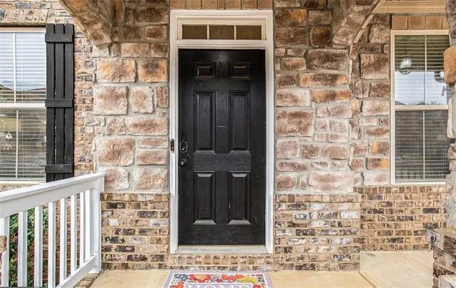 a front view of a building with a door and a window