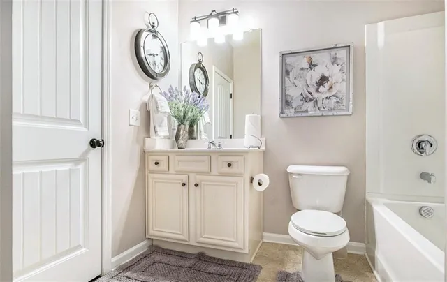 a bathroom with a toilet and a sink