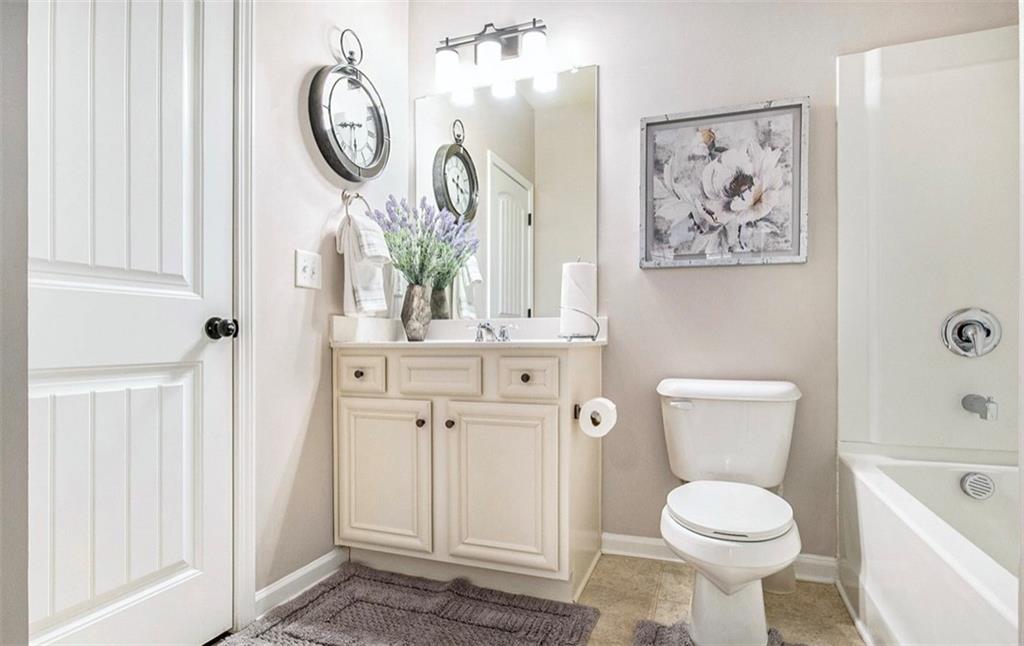 3217 Bowlin Drive Fairburn, GA 30213 - Photo 22 of 28 a bathroom with a toilet and a sink