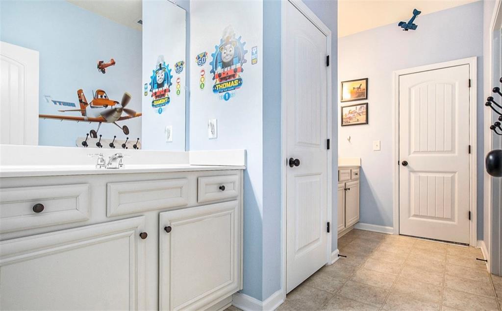 3217 Bowlin Drive Fairburn, GA 30213 - Photo 25 of 28 a bathroom with a sink and a mirror