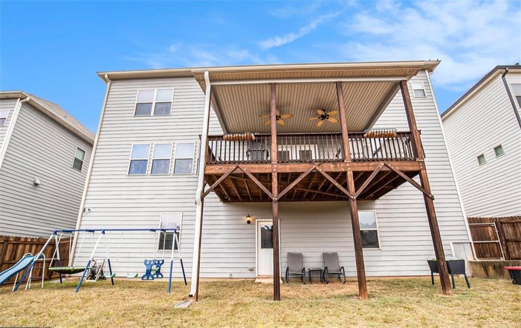 3217 Bowlin Drive Fairburn, GA 30213 - Photo 27 of 28 a view of a house with wooden fence