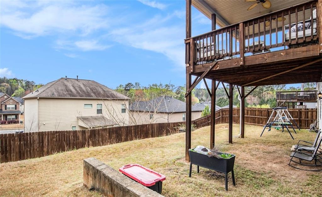 3217 Bowlin Drive Fairburn, GA 30213 - Photo 28 of 28 a view of a roof deck with couches chairs and wooden floor
