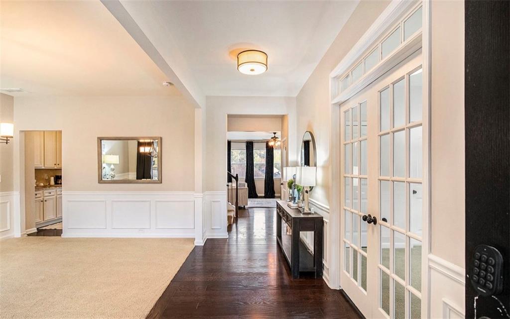 3217 Bowlin Drive Fairburn, GA 30213 - Photo 6 of 28 a view of a hallway with wooden floor and windows