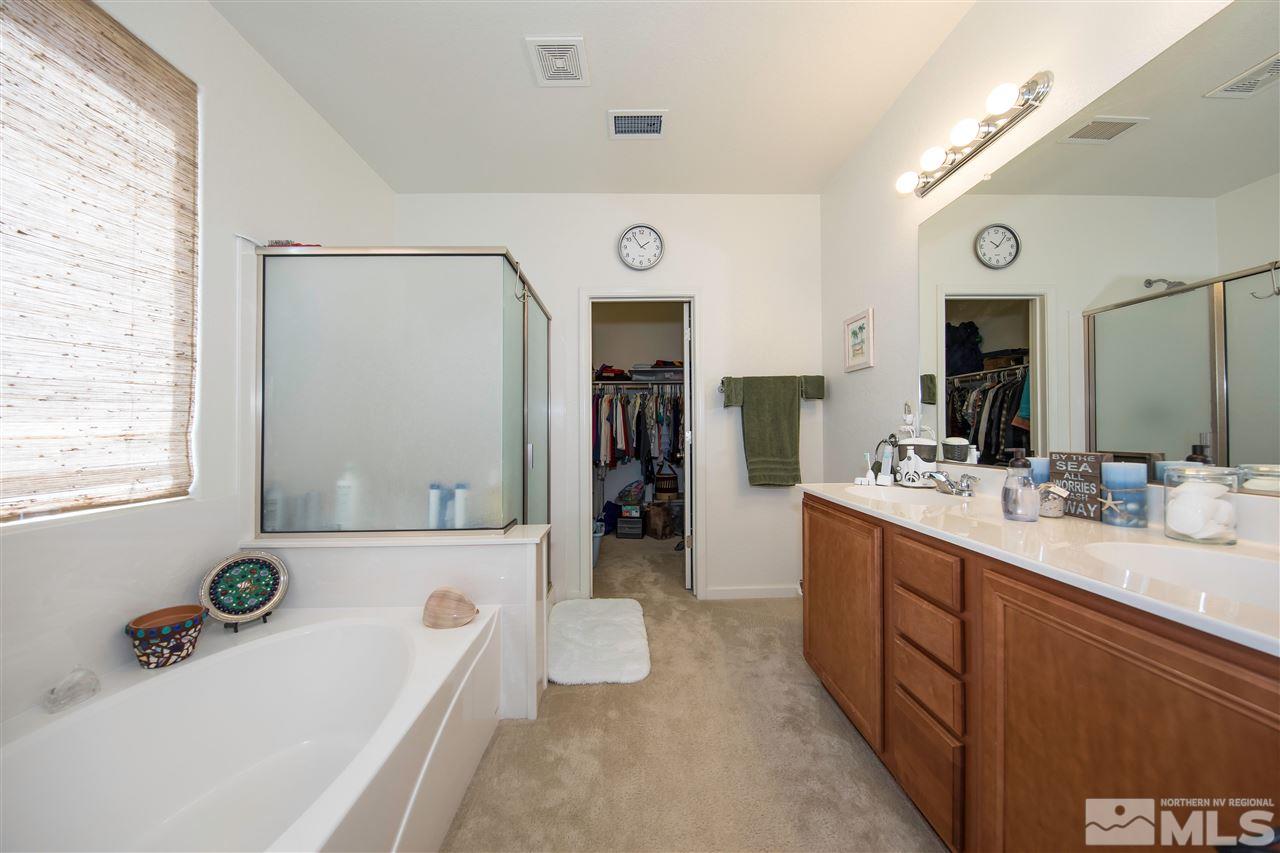 11370 Verazae Drive Reno, NV 89521 - Photo 8 of 17 a bathroom with a tub sink and mirror