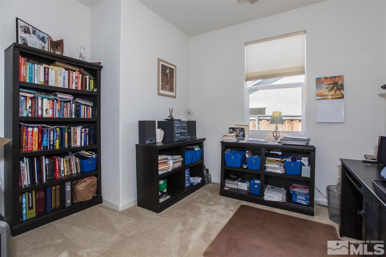 11370 Verazae Drive Reno, NV 89521 - Photo 9 of 17 a room with furniture and a book shelf