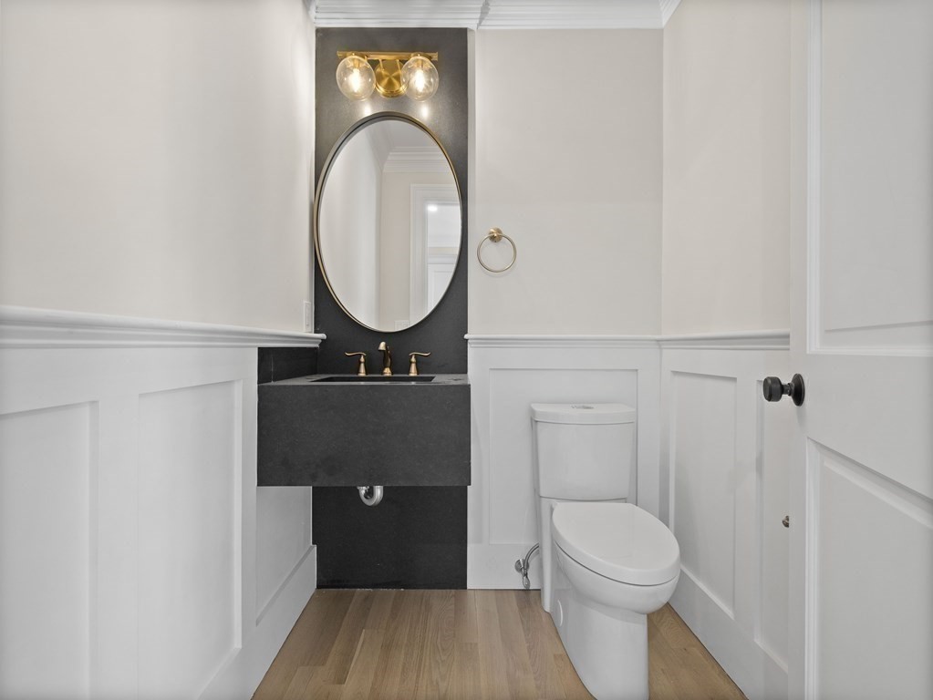 117 Abbott Road Wellesley, MA 02481 - Photo 15 of 34 a bathroom with a toilet a sink and a mirror