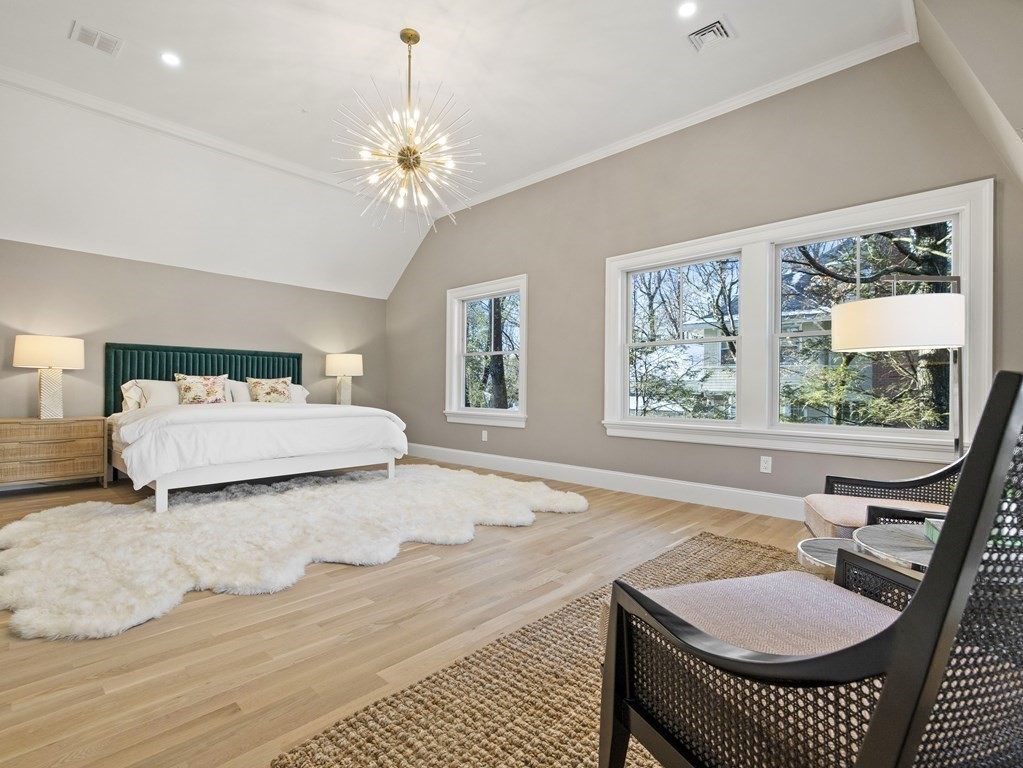 117 Abbott Road Wellesley, MA 02481 - Photo 17 of 34 a spacious bedroom with a bed dresser and a window