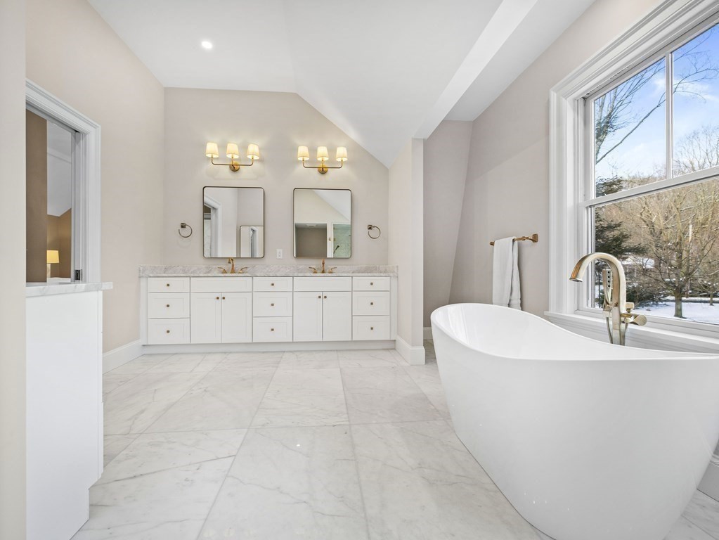 117 Abbott Road Wellesley, MA 02481 - Photo 19 of 34 a bathroom with a sink a vanity and a mirror