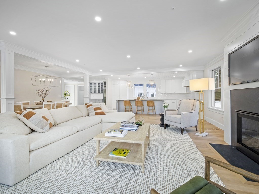 117 Abbott Road Wellesley, MA 02481 - Photo 2 of 34 a living room with furniture and a fireplace