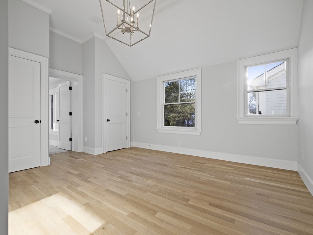 117 Abbott Road Wellesley, MA 02481 - Photo 21 of 34 a view of an empty room with wooden floor and a window